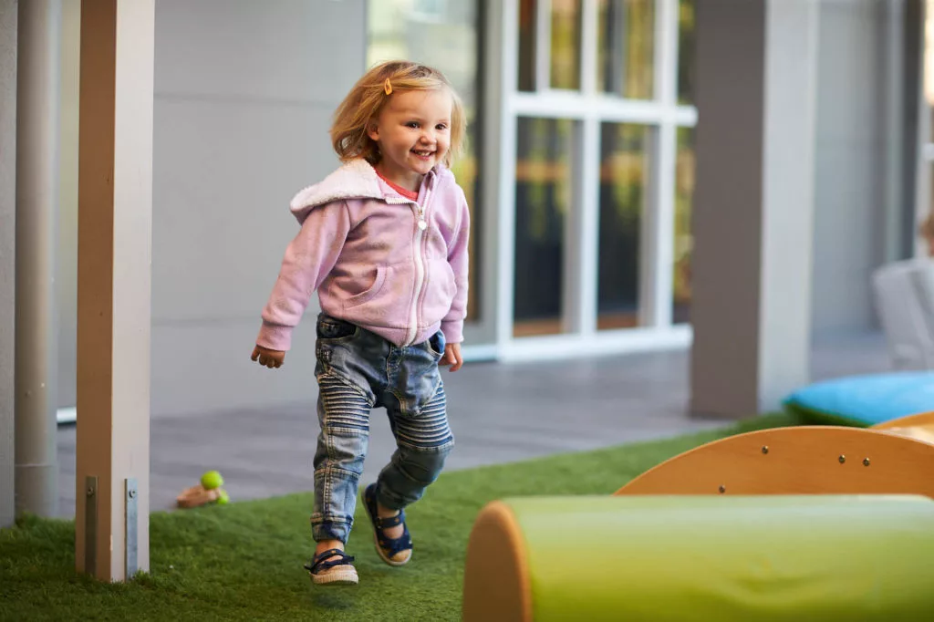 young girl playing outside