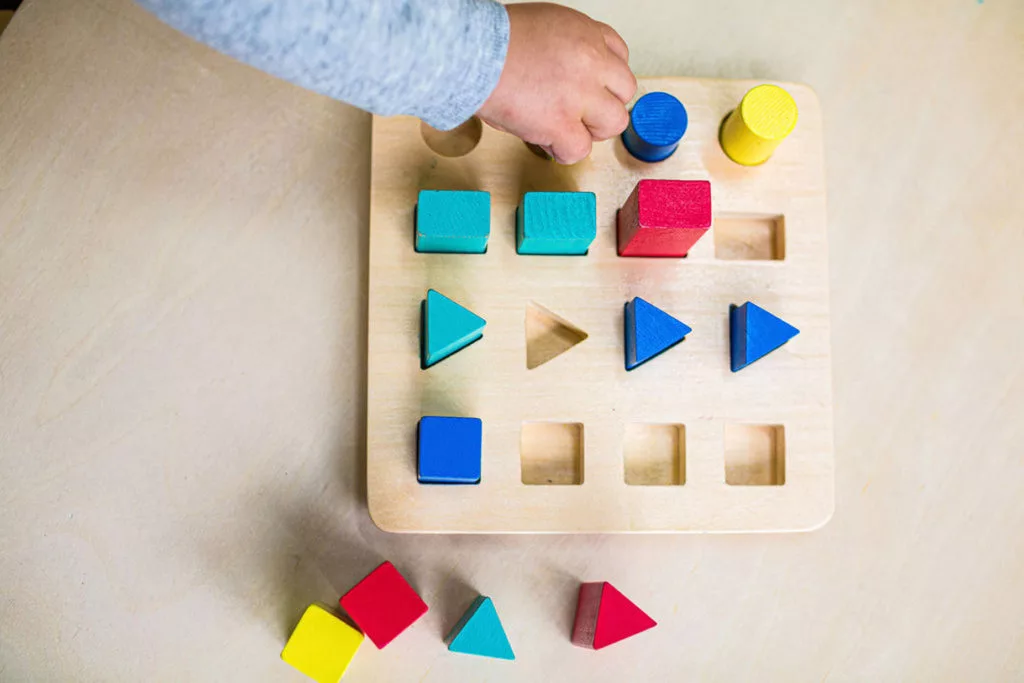 toddler playing with shapes
