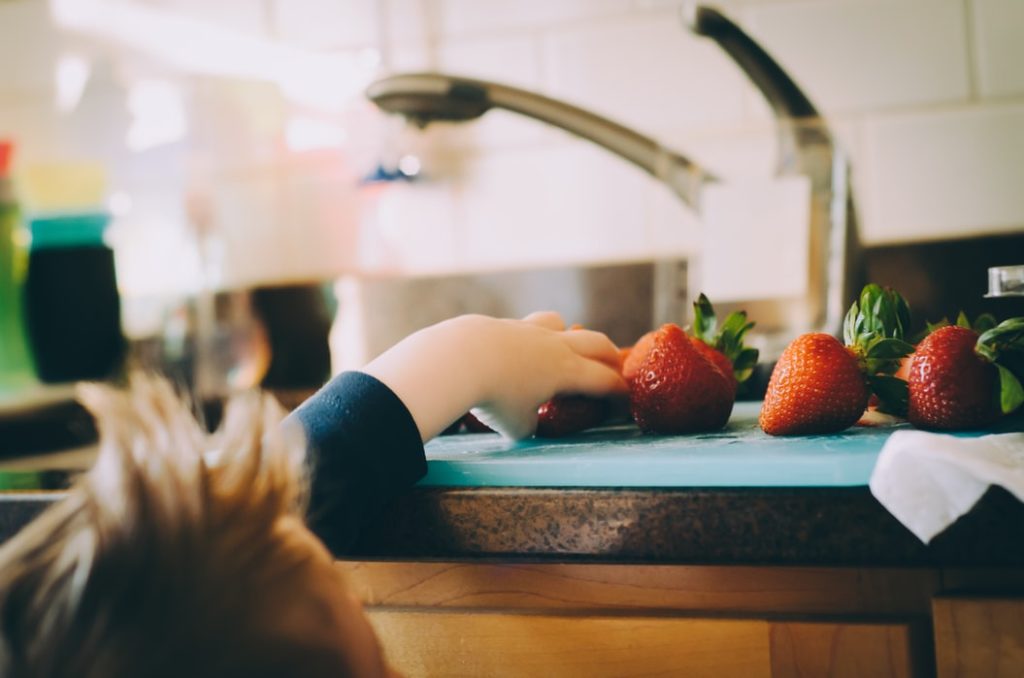 Child reaching for fresh food